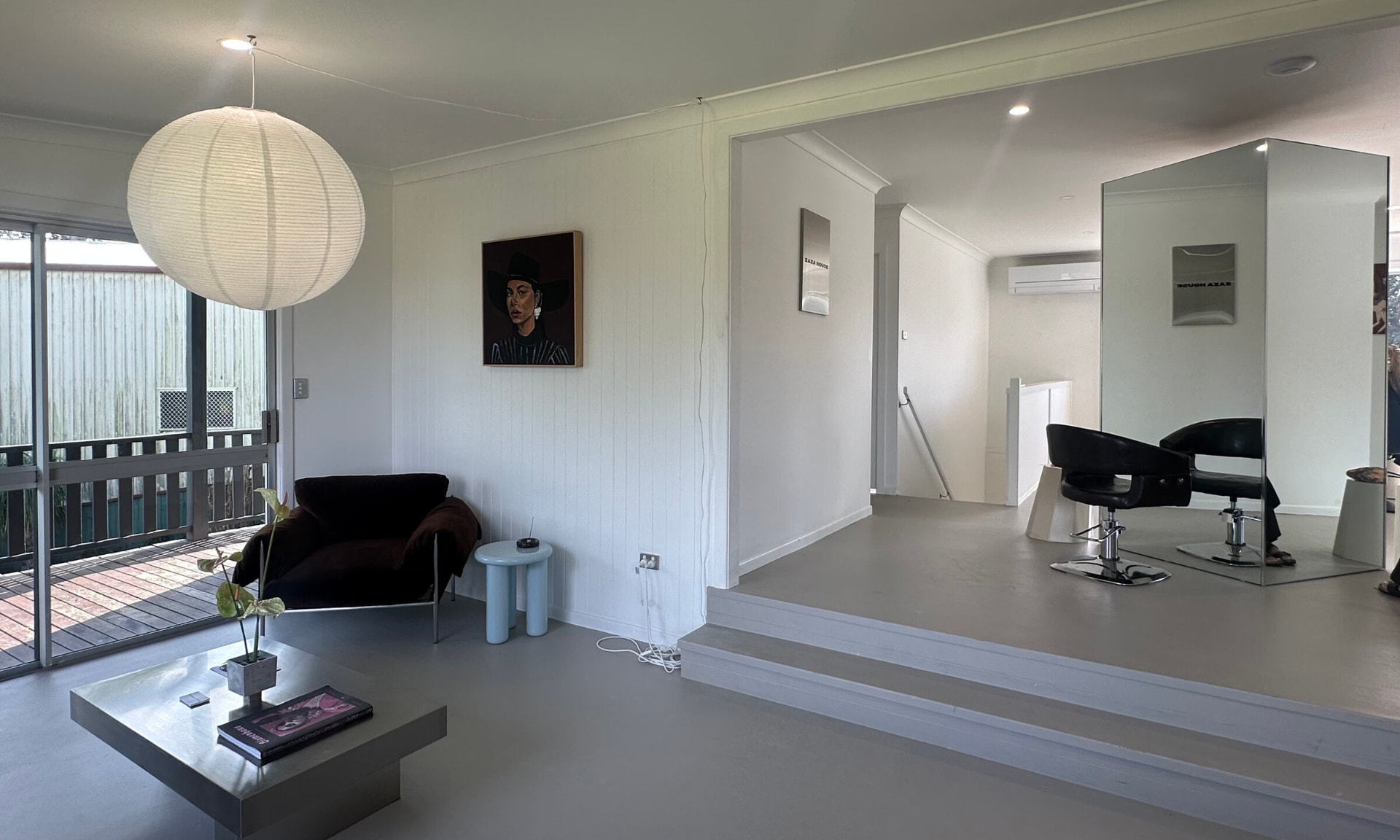 Zaza House interior with artwork and mirrored styling station
